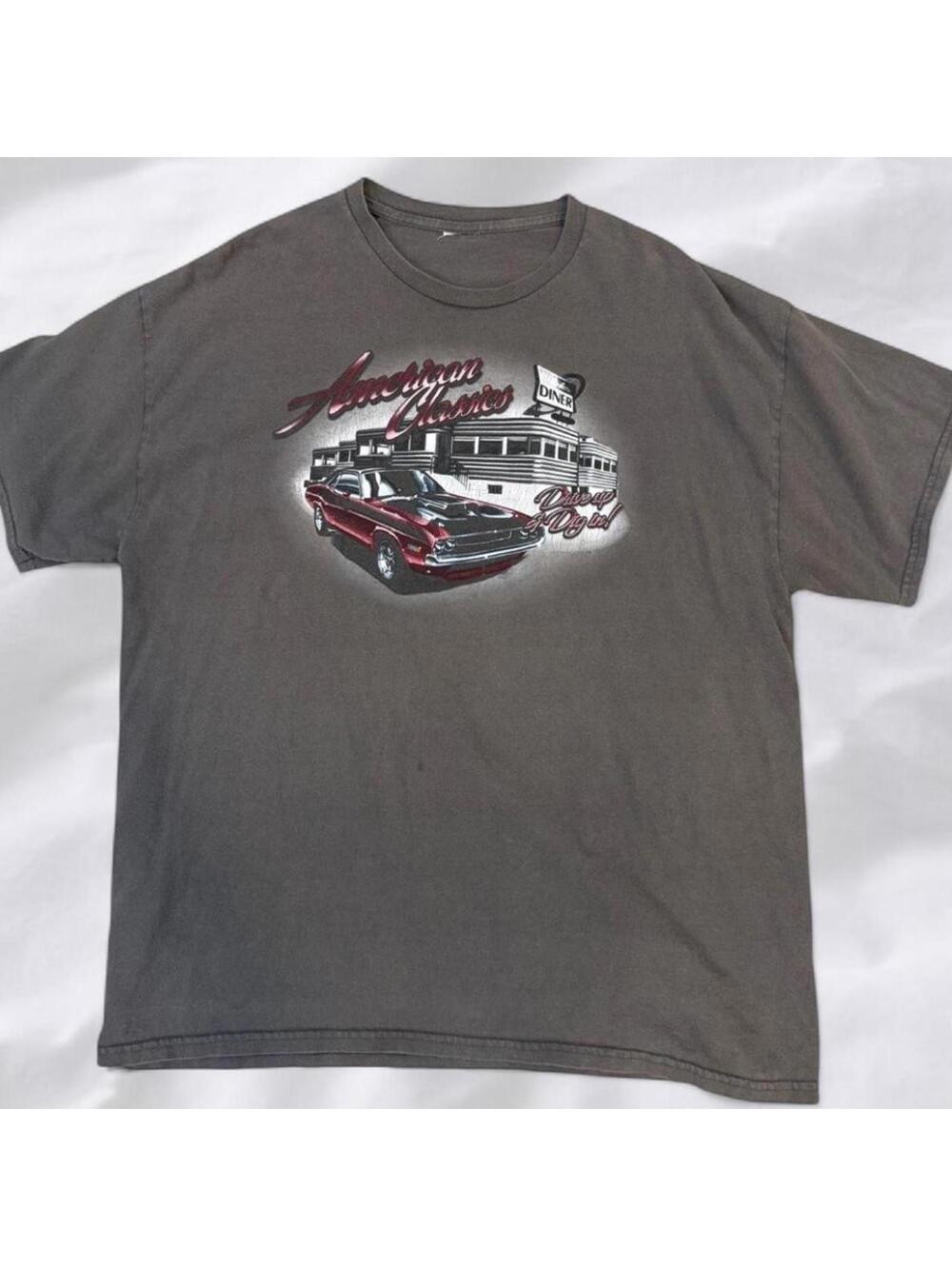 Vintage-style faded graphic tee with classic car print.
